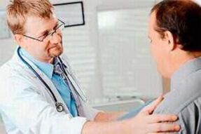 A man with prostatitis at an appointment with a doctor
